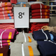 A woman looks at clothes after the opening of Primark's new Spanish flagship store in Madrid, Spain, October 15, 2015. Primark opened a glitzy new flagship store in Madrid on Thursday, squarely planting the budget fashion retailer in the Spanish backyard of Zara-owner Inditex. By opening its second-biggest store in the world in Spain, Primark, owned by Associated British Foods, signalled its confidence in its future in Spain after 10 years of quietly building up a chain of around 40 stores there. REUTERS/Andrea Comas - GF10000246050